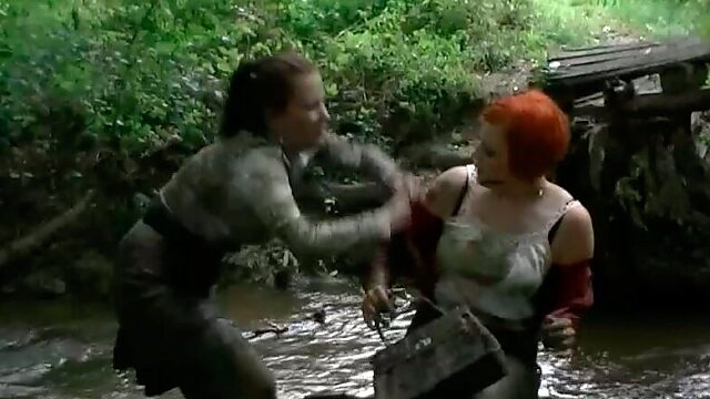Two hot redhead and brunette bitches have a catfight in mud