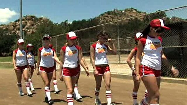 Female baseball team working out outdoor wearing sexy uniform