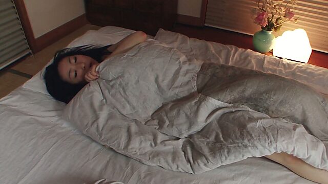 Solo Asian gal Emiko Koike toying her pussy before falling asleep