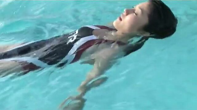 Athletic Japanese girl Mikie Hara swims in a pool like a real pro