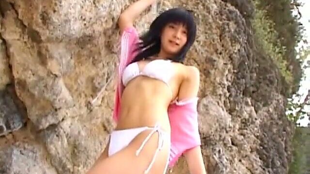 Alluring Japanese model Miu Nakamura works her body on a beach