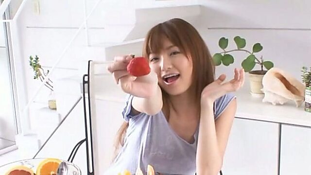Captivating Japanese model Saori Yoshikawa eats strawberry